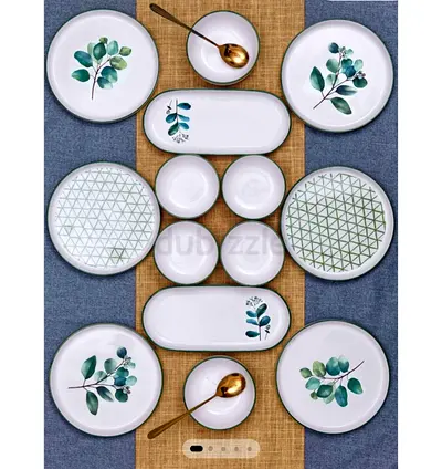 UNUSED 14-piece ceramic dinnerware set with botanical design (plates & bowls)