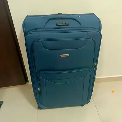 Large blue Flymax soft-shell suitcase — good condition