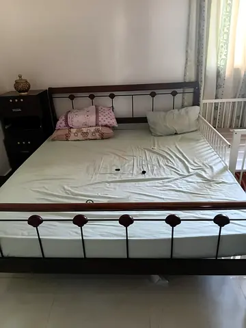 Steel and wooden king size bed with mattress