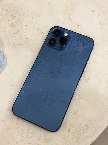 iPhone 12Pro Max 256GB (Blue) - Back Glass Cracked, Works fine, no technical issues.