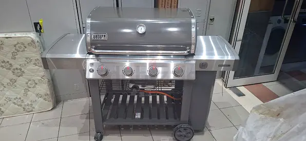 The Weber Genesis Gas Barbecue E-415W is a top-tier grilling appliance designed for both novicv