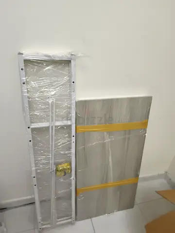 Disassembled cabinet/wardrobe panels and metal frame - unused