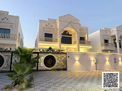 Villa for sale in Al Amra, Ajman, featuring a spacious plot; includes electricity, water, and air conditioning units.