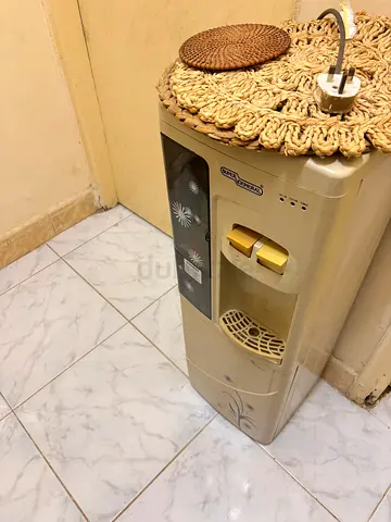 Used freestanding water dispenser / cooler - beige