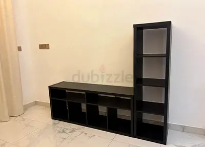 Black modular TV unit with tall shelving - good condition