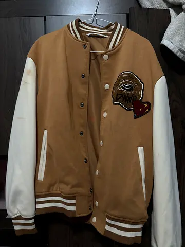 Brown varsity jacket with white sleeves, size approx M (negotiable)