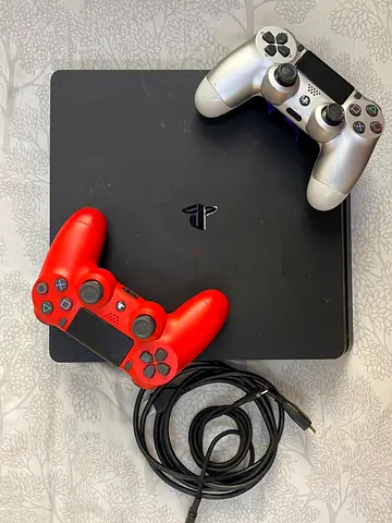 PlayStation 4 Slim with 2 DualShock 4 controllers (working condition)