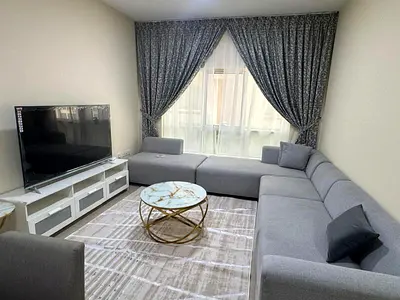 For monthly rent: a fully furnished, hotel-style apartment with two rooms and a living area, located in Al Qasimia, Sharjah.