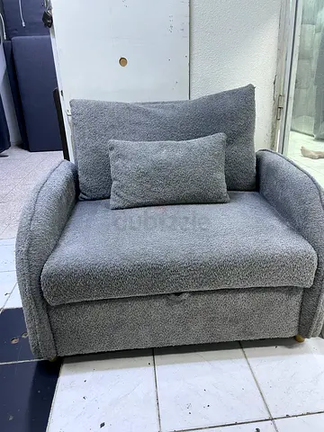 Single grey boucle armchair with cushion - good condition