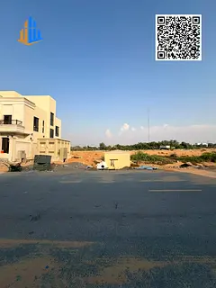 Independent plot of land for sale in Al Helio 1, Ajman | Located on a street and a side path (sikka)
