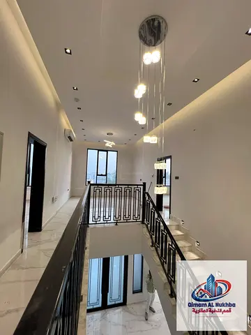 Al Tarfa villa, AED 170K, 5 master bedrooms, 2 living halls, large yard, internal parking for 4 cars, modern finishes, 4 or 6 payments.