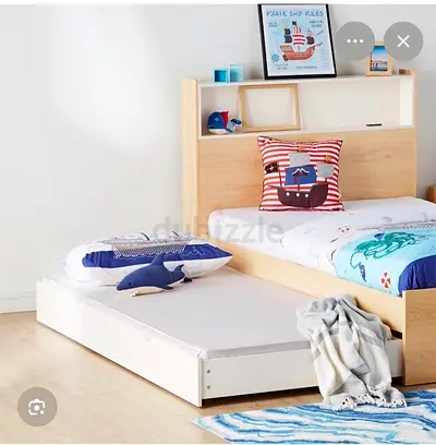 HomeCentre Bed with additional bed and mattress extension.