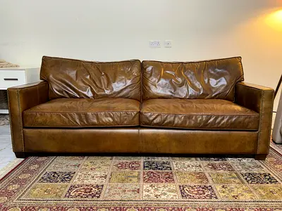 Genuine brown leather 3-seater sofa in good condition