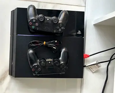 PlayStation 4 with 2 Controllers Plus Games - Excellent Working Condition.