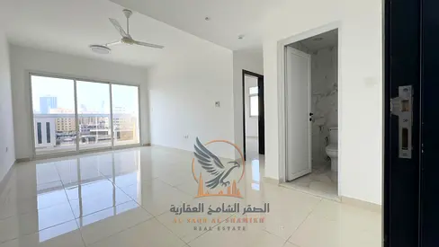Ajman Al Rashidiya 2, one-bedroom apartment, first occupancy, excellent size, high-end finishing, central air conditioning, and two balconies.