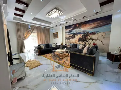 For annual rent in Al Rawda 1 Ajman A luxurious fully furnished villa with 5 master bedrooms a separate majlis two living rooms and a maid's room