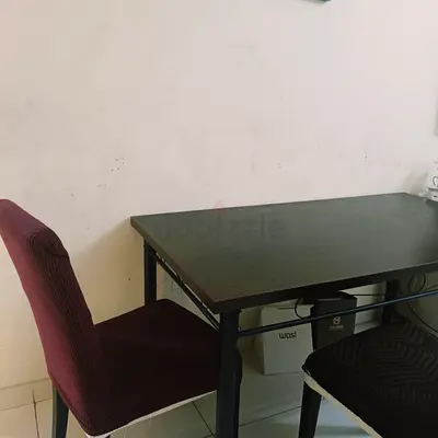 Simple dark wood dining table with two chairs - excellent condition