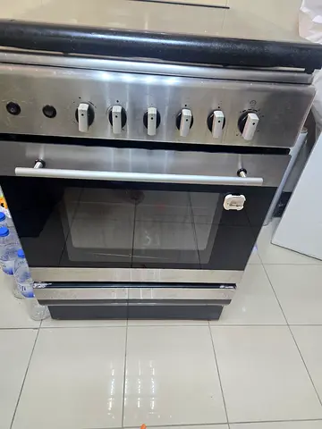 Stainless steel freestanding gas oven with stovetop - used