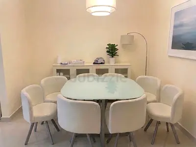 White glass top dining table with 6 upholstered swivel chairs - excellent condition