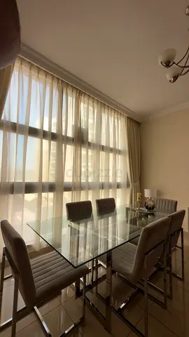 Glass Top with Stainless Steel Dining Table with 6 Upholstered Chairs - Good Condition
