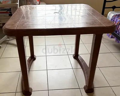 brown plastic dining, study and multipurpose table, sturdy and easy to clean. can be detached to tr