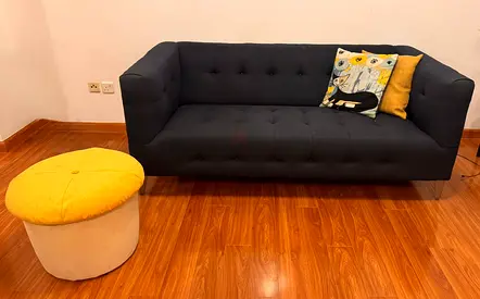 Dark Blue 3-seater sofa with yellow ottoman / pouffe and cushions