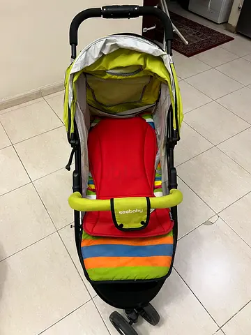Bright multi-color baby stroller in good condition