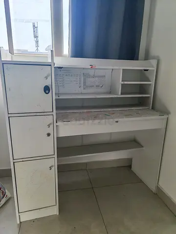 White wooden study desk with storage cabinets and shelves for free