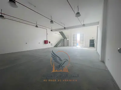 New warehouse with a mezzanine, bathroom, and modern fire system in Al Jurf Industrial Area.