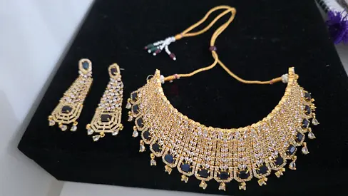 Gold-tone traditional necklace set with matching earrings (used)