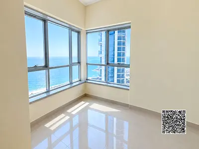 Huge 2BHK in Corniche Tower, Ajman! 2,300 sqft, full sea view, big balcony, 3 baths, closed kitchen. Vacant & move-in ready. High-end coastal living.