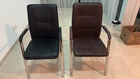 Pair of black leather chairs