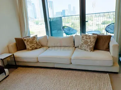 3-seater cream fabric sofa in good condition and 2 seater