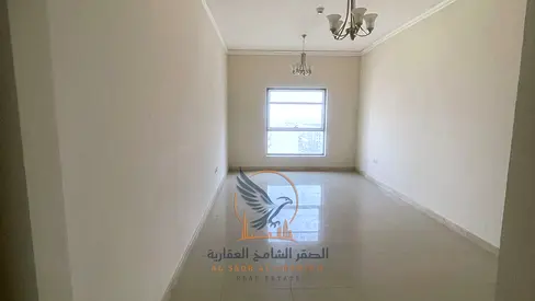 Three-bedroom apartment with a living room and balcony with an open view, available for annual rent in Ajman, Al Nuaimiya 1 area.