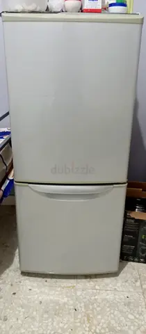 Compact two-door refrigerator in good working condition