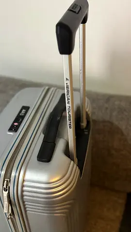 American Tourister silver hard-shell carry-on suitcase (good condition)