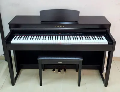 The Yamaha Clavinova CLP-430R (Rosewood finish) is an 88-key digital piano featuring Graded Hammer