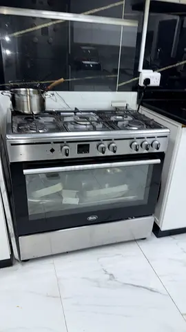 Used freestanding 5-burner stainless steel gas cooker with oven