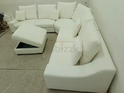 Premium quality brand new condition indigo living brand corner sofa with storage ottoman