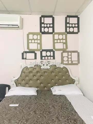 Upholstered tufted double bed with decorative headboard