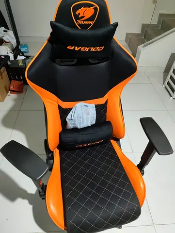 Cougar gaming/office chair — black and orange, adjustable armrests