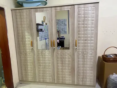 4-door mirrored wardrobe in light wood finish - new used only 2month