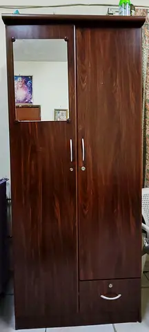 Two-door wooden wardrobe with mirror and bottom drawer - good condition