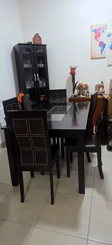 6 seater dining table, very good condition, black with centre glass top.