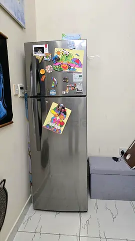 Silver double-door refrigerator in prime condition