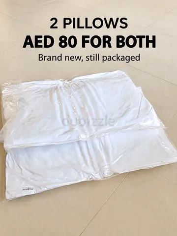 Two brand new packaged pillows — AED 80 for both