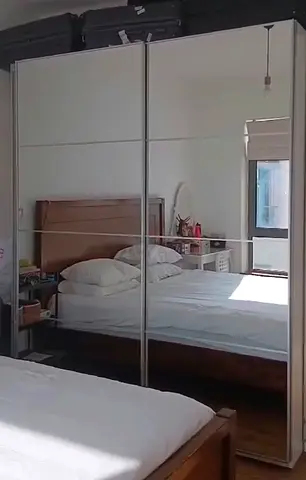 White mirrored sliding-door wardrobe — good condition