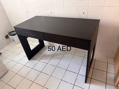 Simple dark wood study desk with two drawers - 50 AED