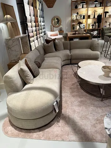Light beige curved sectional sofa