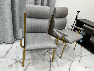 Set of 2 modern grey upholstered lounge chairs with gold frame, very solid